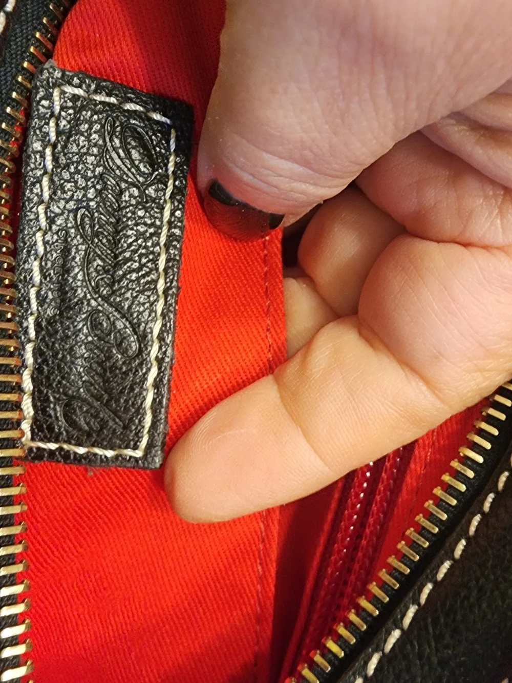vintage Dooney & Bourke black leather shoulder bag featuring gold-tone hardware